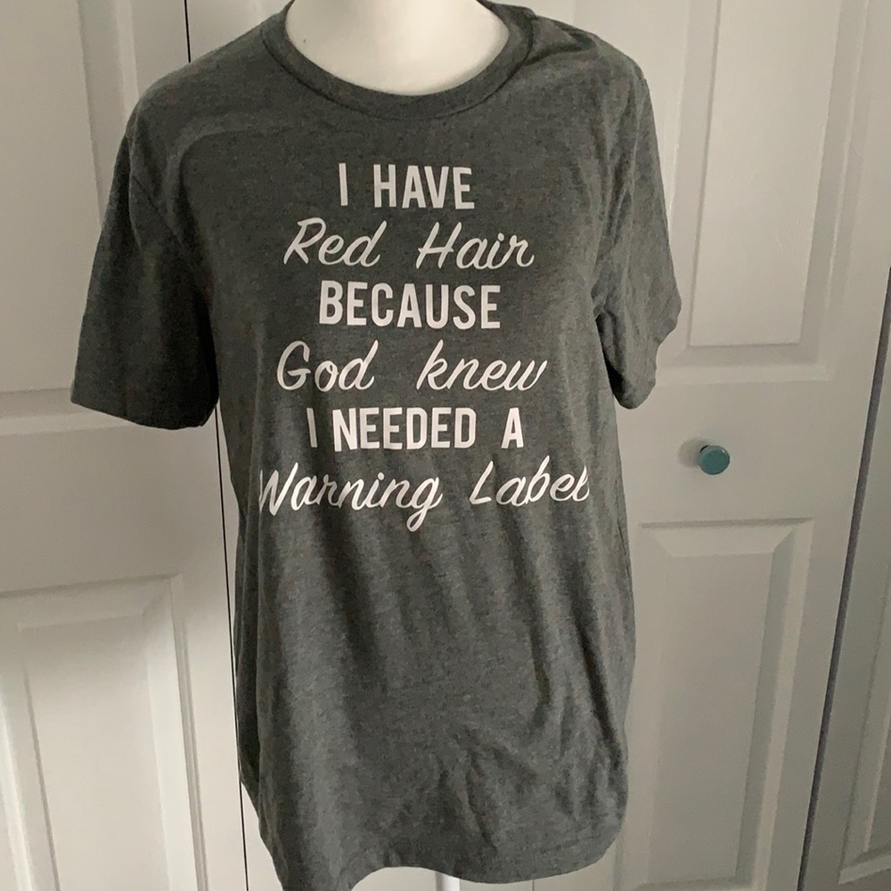 Never worn graphic tee size Medium.